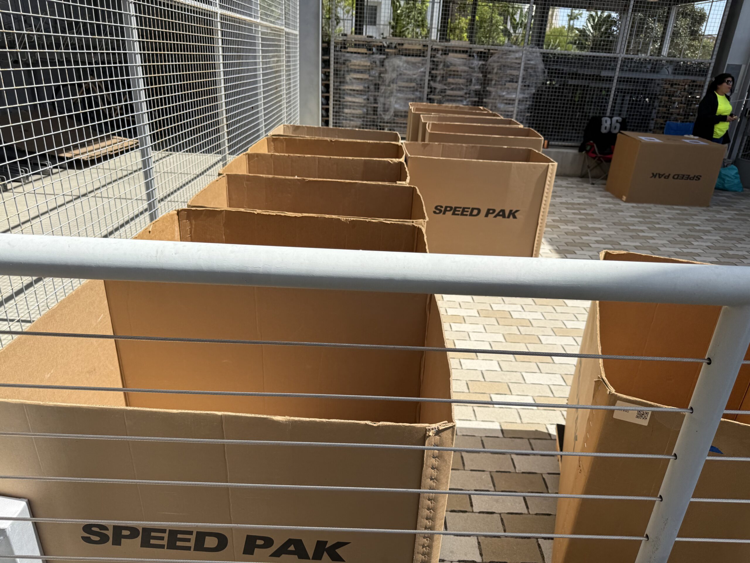 Rows of Speed Pak rolling moving bins at UC Irvine Plaza Verde